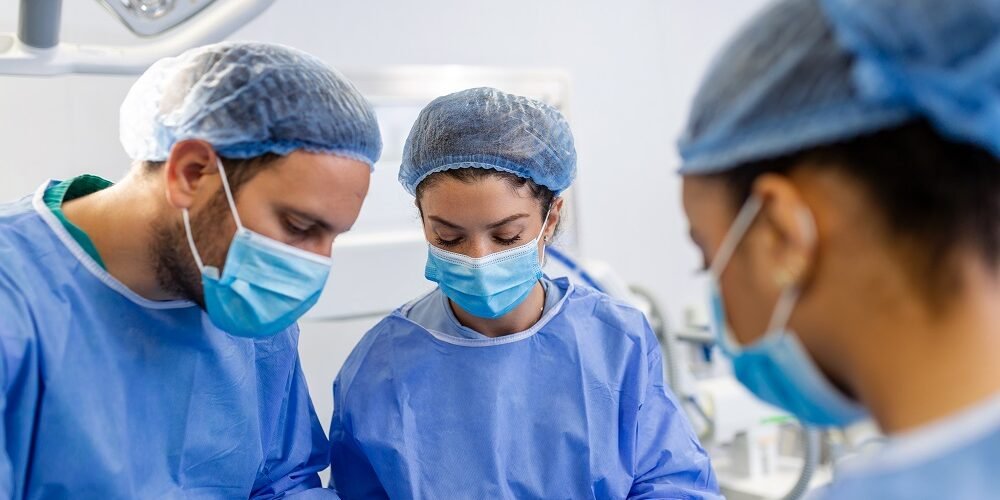 Shot of a team of surgeons performing a surgery in an operating theatre